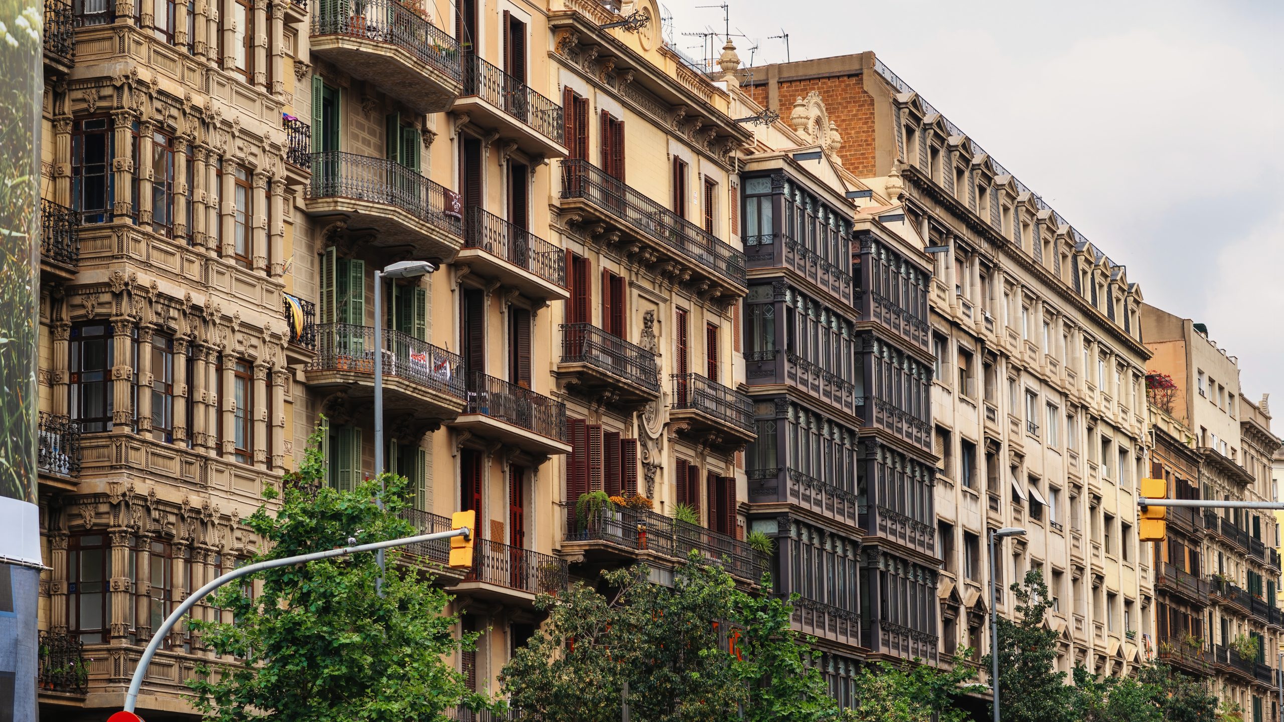 Row of old buildings made in classic style in Barcelona
